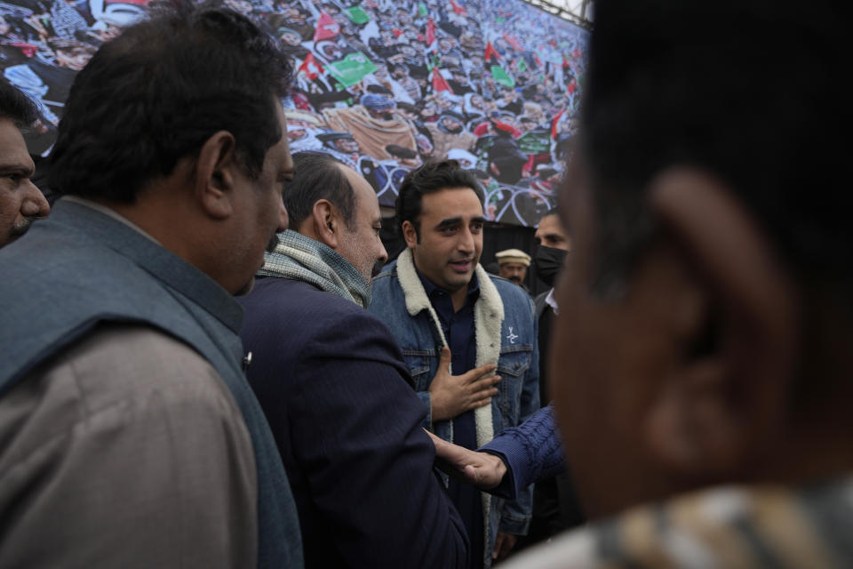Bilawal Bhutto Zardari, center, Chairman of Pakistan People's Party talks with party's aids during an election campaign rally, in Bhalwal, Pakistan, Wednesday, Jan. 24,2024. (AP Photo/Anjum Naveed)
