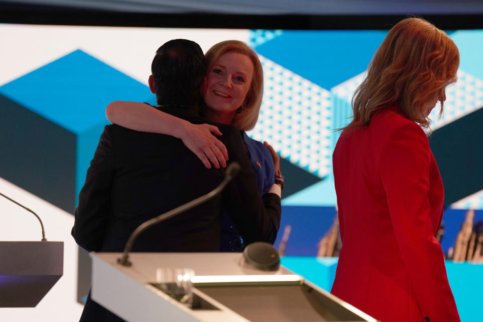 HANLEY, ENGLAND - JULY 25:  Rishi Sunak and Liz Truss hug each other after taking part in the BBC Leadership debate presented by Sophie Raworth (R) at Victoria Hall on July 25, 2022 in Hanley, England. Former Chancellor Rishi Sunak and Current Foreign Secretary Liz Truss go head-to-head in the BBC Conservative Leadership debate in their bid to win the contest and become the UK's next Prime Minister. (Photo by Jacob King - WPA Pool/Getty Images)