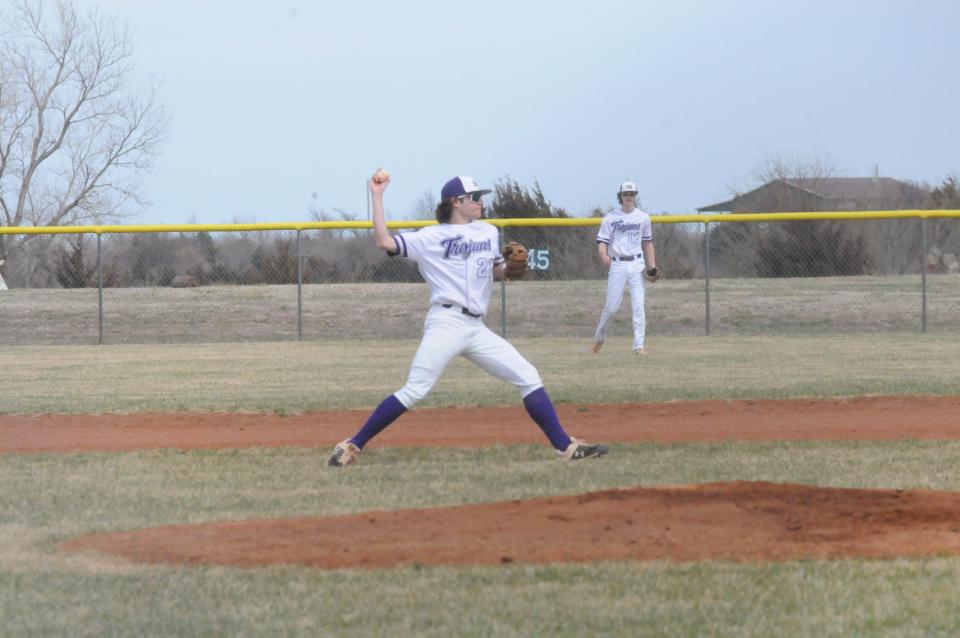 Southeast of Saline's Luke Gebhardt (21) fields a ball during a doubleheader against Smoky Valley Friday at Southeast of Saline.