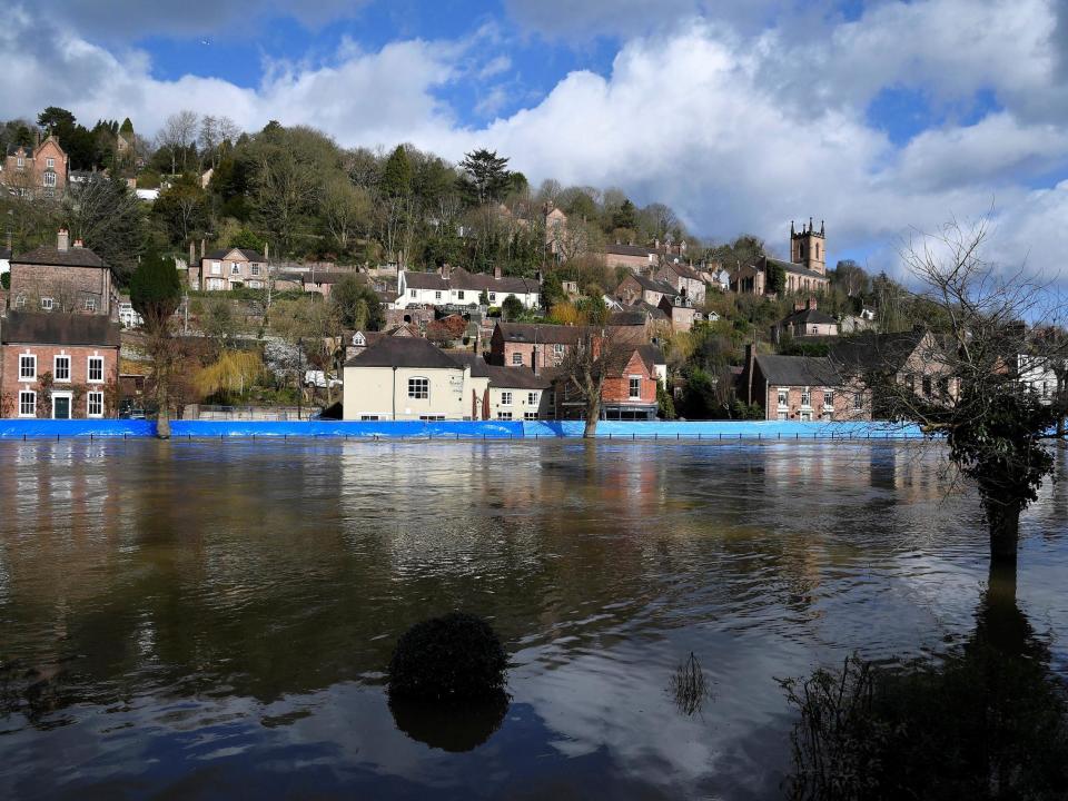 Flood defences are seen after being pushed back by high water levels on the River Severn, Ironbridge, on February 27, 2020: REUTERS/Toby Melville