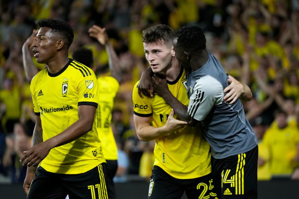 Jul 8, 2023; Columbus, Ohio, USA;  Columbus Crew midfielder Yaw Yeboah (14) celebrates a goal by midfielder Sean Zawadzki (25) during the second half of the MLS soccer match against the New York City FC at Lower.com Field. The Crew tied 1-1.