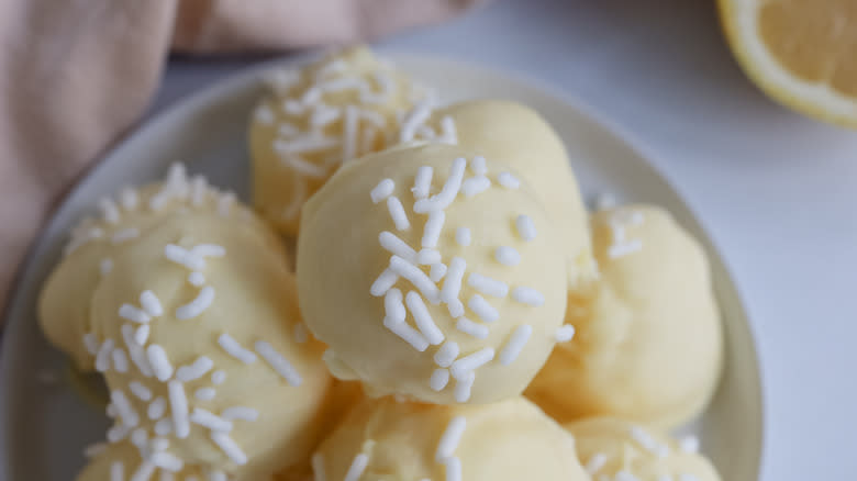 white chocolate lemon truffles on white plate