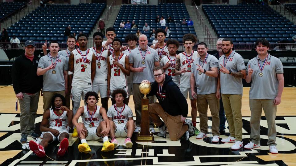 The Newport Wildcats pose with their All "A" state championship trophy after defeating Evangel Christian 69-62 on Jan. 28 at Corbin Arena in Corbin, Ky.