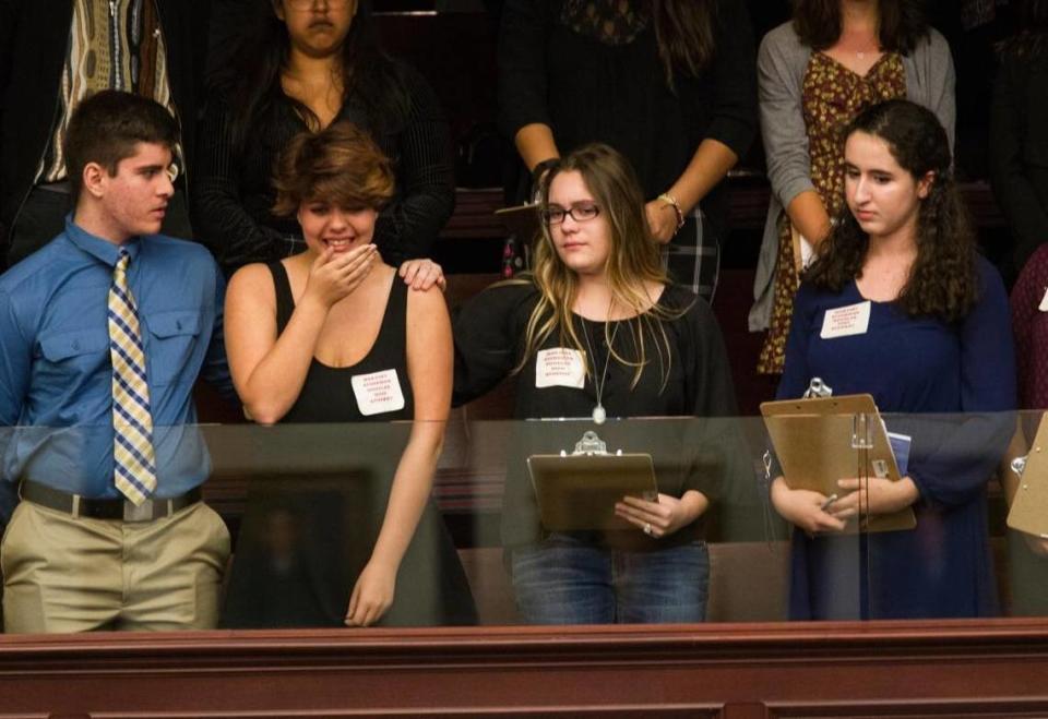 Sheryl Acquarola, a 16-year-old junior from Marjory Stoneman Douglas High School in Parkland, is overcome with emotion in the east gallery of the state House of Representatives after the representatives voted not to hear a bill banning assault rifles and large-capacity magazines at the Capitol in Tallahassee on Feb. 20, 2018.