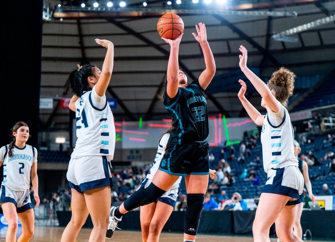 Bonney Lake center Jazmyn Shipp (22) shoots a layup during an opening round game against Meadowdale at the WIAA state basketball tournament in the Tacoma Dome in Tacoma, Washington, on Wednesday, March 1, 2023. Shipp scored her 1,000th career point during the game. Bonney Lake lost the game 35-62.