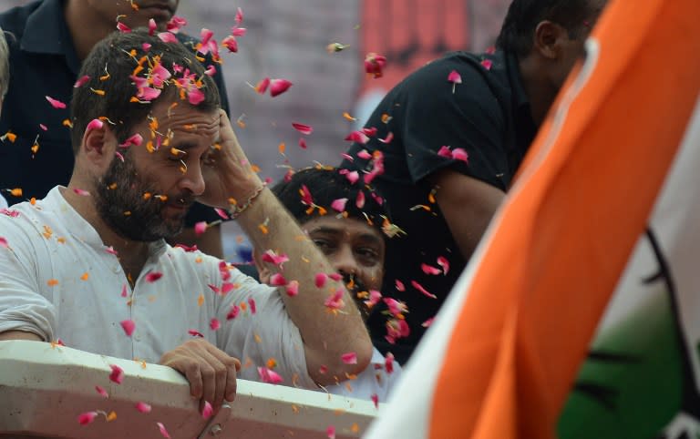 <p>Indian Congress Party vice president, Rahul Gandhi (L) is showered with rose petals during a roadshow in Allahabad on September 15, 2016, ahead of the 2017 Uttar Pradesh State Assembly elections. </p>