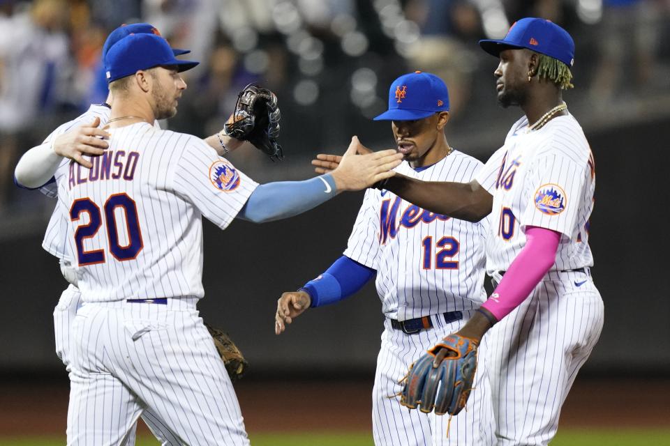 New York Mets' Ronny Mauricio (10) celebrates with Pete Alonso (20) and Francisco Lindor (12) after a baseball game against the Arizona Diamondbacks, Tuesday, Sept. 12, 2023, in New York. The Mets won 7-4. (AP Photo/Frank Franklin II)