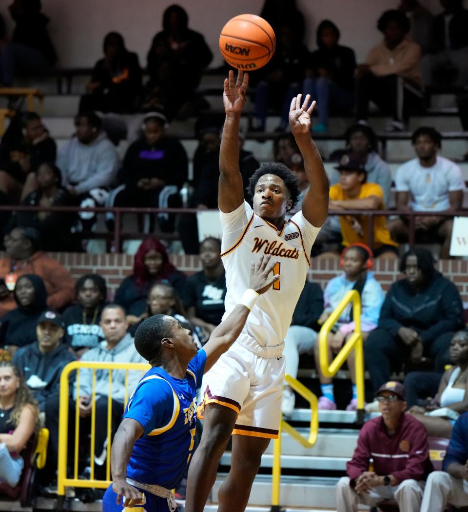 Bethune-Cookman's Zion Harmon shoots a three during a game with Trinity Baptist at Moore Gymnasium, Wednesday, Nov. 15, 2023.
