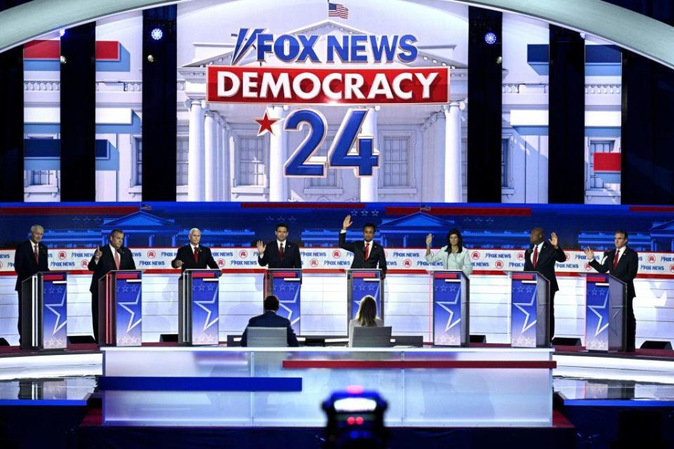 GOP candidates raise their hands to indicate they would support former President Donald Trump as the Republican nominee if he was convicted of a crime on Wednesday, Aug. 23, 2023. / Credit: BRENDAN SMIALOWSKI/AFP via Getty Images