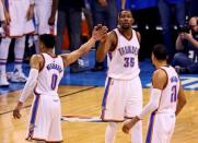 May 22, 2016; Oklahoma City, OK, USA; Oklahoma City Thunder forward Kevin Durant (35) and guard Russell Westbrook (0) and guard Andre Roberson (21) celebrate during the second quarter against the Golden State Warriors in game three of the Western conference finals of the NBA Playoffs at Chesapeake Energy Arena. Mandatory Credit: Kevin Jairaj-USA TODAY Sports