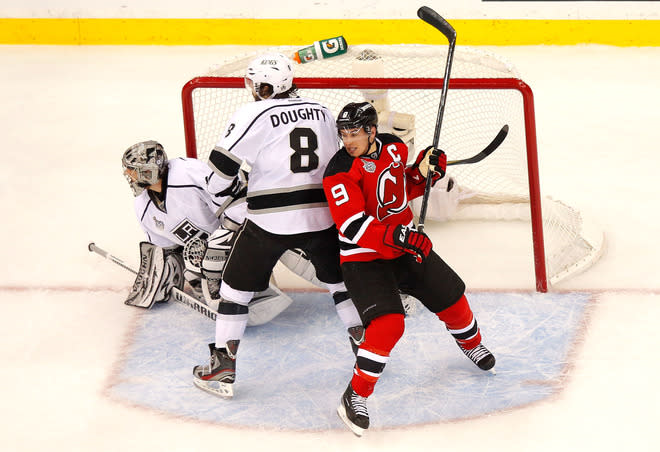 NEWARK, NJ - JUNE 02: Drew Doughty #8 of the Los Angeles Kings and Zach Parise #9 of the New Jersey Devils fight for position in front of Jonathan Quick #32 of the Los Angeles Kings during Game Two of the 2012 NHL Stanley Cup Final at the Prudential Center on June 2, 2012 in Newark, New Jersey. (Photo by Paul Bereswill/Getty Images)