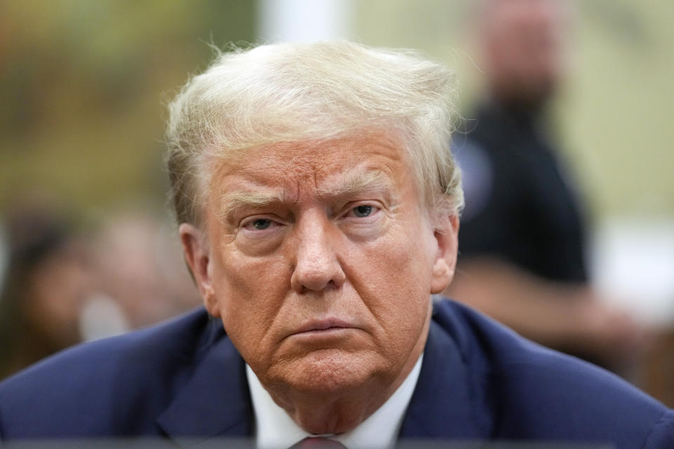 FILE - Former President Donald Trump sits in the courtroom before the continuation of his civil business fraud trial at New York Supreme Court, Tuesday, Oct. 3, 2023, in New York. Donald Trump’s lawyers asked a New York appeals court Friday to halt his Manhattan civil fraud trial while they fight a court ruling that calls for dissolving companies that control some of the former president’s most prized assets, including Trump Tower. (AP Photo/Seth Wenig, Pool)