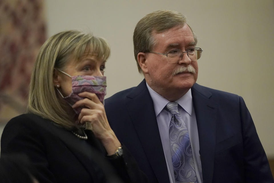 David Harris, right, and Birgit Fladager, both of the Stanislaus County District Attorney's office, stand during a break in a hearing at San Mateo County Superior Court in Redwood City, Calif., Monday, Feb. 28, 2022. (AP Photo/Jeff Chiu, Pool)