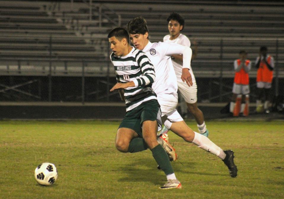 Mandarin midfielder Omar Trto (10) dribbles upfield against Sandalwood in the Gateway Conference boys soccer tournament on Jan. 11.