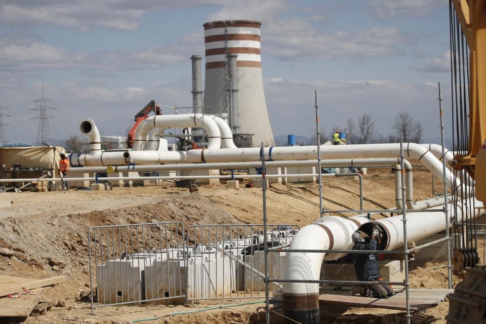 A man works at the worksite of a new pipeline near Komotini town, northern Greece, Monday, March 21, 2022. Crossing a remote border area of Greece and Bulgaria, a new pipeline nearing completion will help countries in the region dependent on Russian imports greater access to the global natural gas market.(Dimitris Tosidis/AMNA via AP)