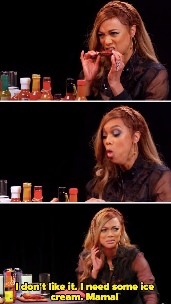 Tyra Banks having an immediate negative reaction after eating a spicy wing and calling for her mother to bring her ice cream