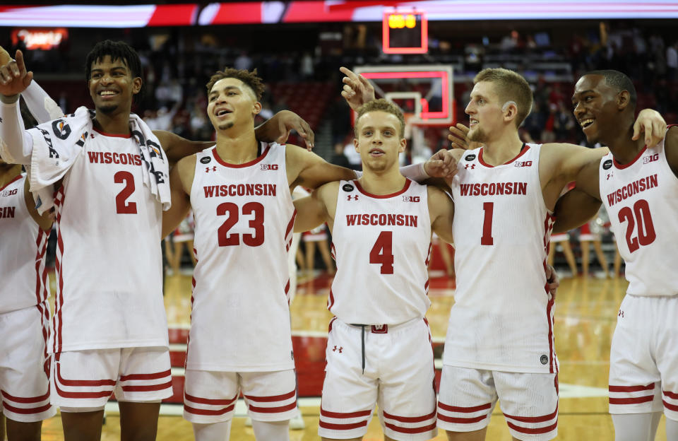 Nov 17, 2019; Madison, WI, USA; The Wisconsin Badgers team sing the school song “Varsity” after defeating the Marquette Golden Eagles at the Kohl Center. Mandatory Credit: Mary Langenfeld-USA TODAY Sports