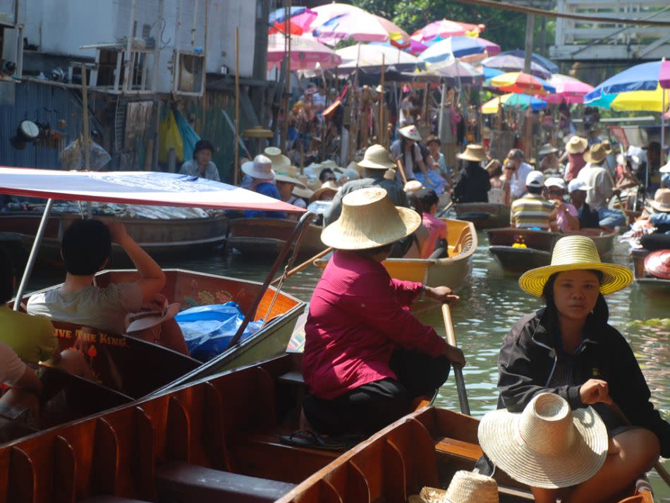 Tourists throng the busy market