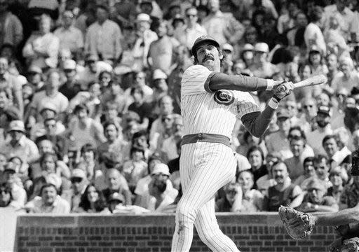 Chicago Cubs outfielder Dave Kingman follows through at left as he sends a two-run homer toward the fence at Wrigley Field, May 17, 1979, in Chicago.  Kingman hit three homers in the game and accounted for six runs. Mike Schmidt of the Phillies hit two homers, and Philadelphia beat Chicago 23-22 in 10 innings at Wrigley Field. Bill Buckner had a grand slam and seven RBIs for Chicago. The game included 11 home runs and 50 hits.