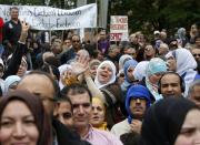 Demonstrator protest against Quebec's proposed Charter of Values in Montreal, September 14, 2013. Thousands took to the streets to denounce the province's proposed bill to ban the wearing of any overt religious garb by government paid employees. REUTERS/ Christinne Muschi(CANADA - Tags: POLITICS CIVIL UNREST RELIGION)