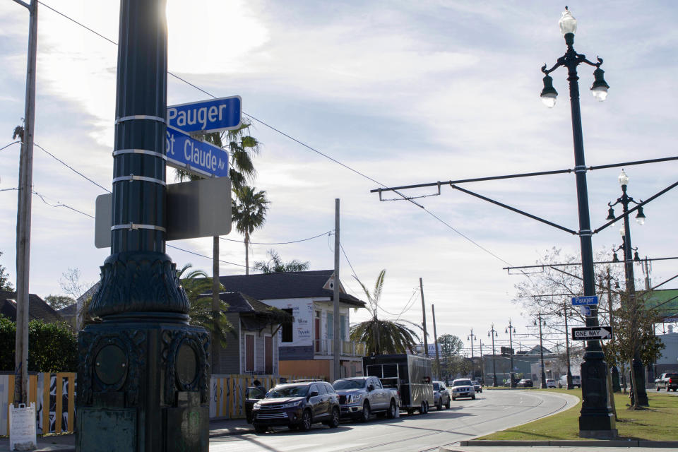 A street sign hangs on St. Claude Avenue, Jan. 30, 2021, in New Orleans. The toll of this year’s toned-down Mardi Gras is evident on St. Claude Avenue, an off-the-beaten-track stretch that has become a destination in recent years. (AP Photo/Dorthy Ray)