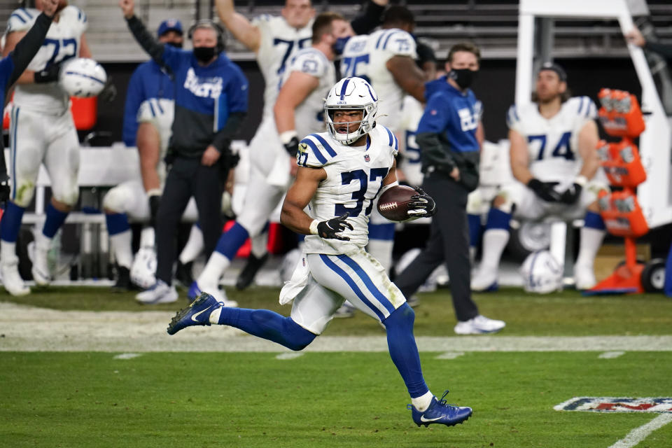 FILE - Indianapolis Colts safety Khari Willis (37) returns an interception for a touchdown during the second half against the Las Vegas Raiders in an NFL football game, on Dec. 13, 2020, in Las Vegas. Willis announced in a Twitter post on Wednesday, June 15, 2022, that he has decided to retire so he can pursue a career in the ministry. (AP Photo/Jeff Bottari, File)