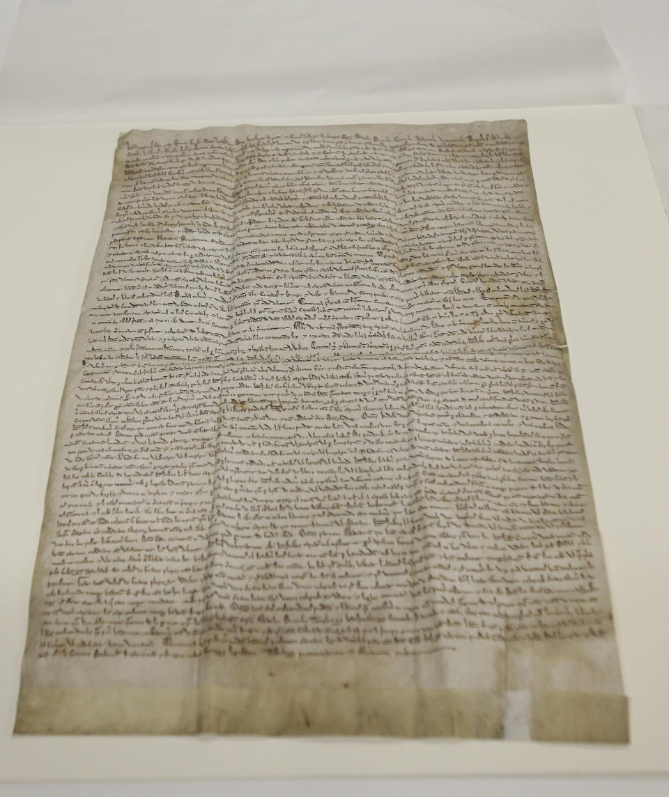 In this Wednesday, Feb. 5, 2014 photo, the historic Magna Carta lies on a table in a museum workroom, in Houston. The centuries old parchment, which has never left England before, will be on display at the Houston Museum of Natural Science for six months starting Feb. 14, 2014. (AP Photo/Pat Sullivan)