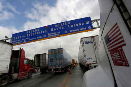 FILE PHOTO: Trucks wait in the queue for border customs control to cross into U.S. at the World Trade Bridge in Nuevo Laredo, Mexico, November 2, 2016. Picture taken November 2, 2016. REUTERS/Daniel Becerril/File Photo