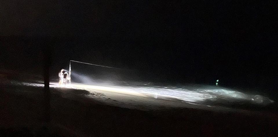 A shark fisherman blasts a bright light into the surf during a late May fishing excursion near Indian River Oaks in south beaches area of Brevard County, next to Archie Carr National Wildlife Refuge, which has among the highest density of sea turtle nesting beaches in the world. A county ordinance ban lights on the beach during turtle nesting season.