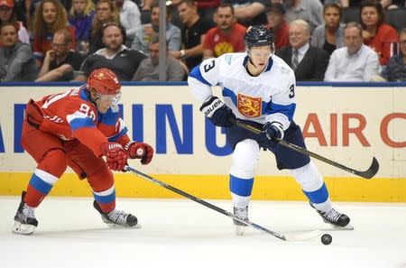 Sep 22, 2016; Toronto, Ontario, Canada; Team Finland defenceman Olli Maatta (3) skates with the puck past a poke check from Team Russia forward Vladislav Namestnikov (90) during preliminary round play in the 2016 World Cup of Hockey at Air Canada Centre. Mandatory Credit: Dan Hamilton-USA TODAY Sports