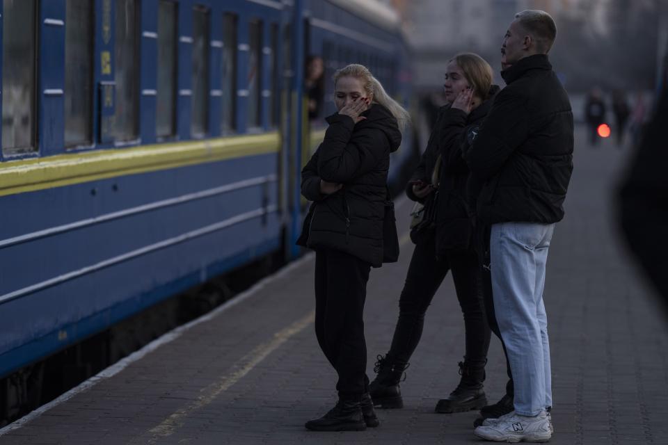 FILE - A woman reacts while a train leaves from the train station in Odesa, southern Ukraine, on March 23, 2022. The Black Sea port is mining its beaches and rushing to defend itself from a Mariupol-style fate. Some Western officials believe the city, which is dear to Ukrainians' hearts, could be next. (AP Photo/Petros Giannakouris, File)
