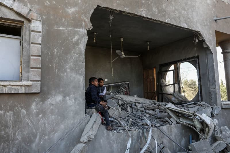 Palestinian children inspect the destruction following an Israeli airstrike on a house belonging to the Al-Faqawi family. Abed Rahim Khatib/dpa