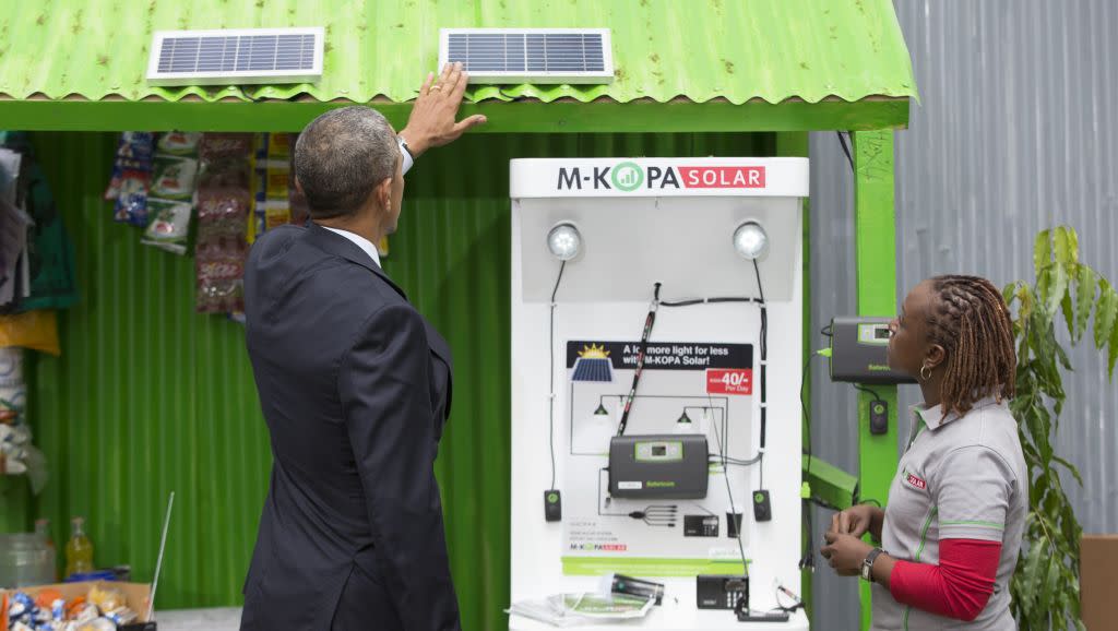 President Barack Obama looks at a solar power exhibit during a tour of the Power Africa Innovation Fair, Saturday, July 25, 2015, in Nairobi. Obama's visit to Kenya is focused on trade and economic issues, as well as security and counterterrorism cooperation.