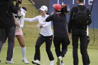 Jin Young Ko of South Korea, center, celebrates with other player after winning at the 18th hole during the final round of the BMW Ladies Championship at LPGA International Busan in Busan, South Korea, Sunday, Oct. 24, 2021. (AP Photo/Lee Jin-man)