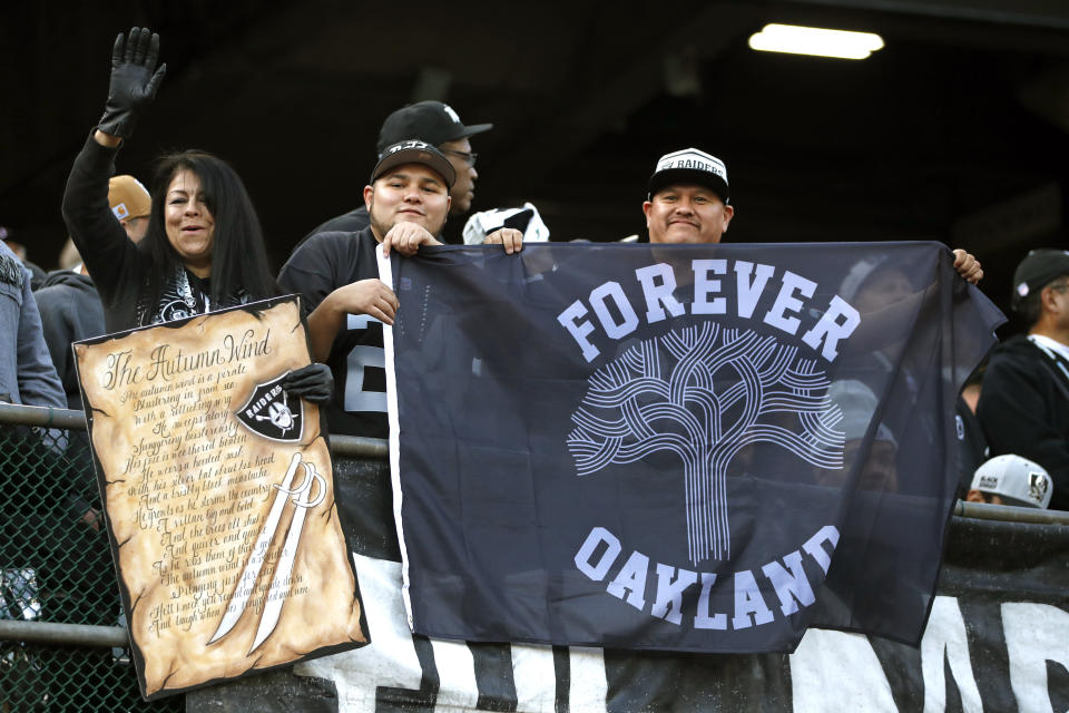 Dec 15, 2019; Oakland, CA, USA; Oakland Raiders fans hold up a flag during the fourth quarter of the game between the Oakland Raiders and the <a class="link " href="https://sports.yahoo.com/nfl/teams/jacksonville/" data-i13n="sec:content-canvas;subsec:anchor_text;elm:context_link" data-ylk="slk:Jacksonville Jaguars;sec:content-canvas;subsec:anchor_text;elm:context_link;itc:0">Jacksonville Jaguars</a> at Oakland Coliseum. Mandatory Credit: Darren Yamashita-USA TODAY Sports