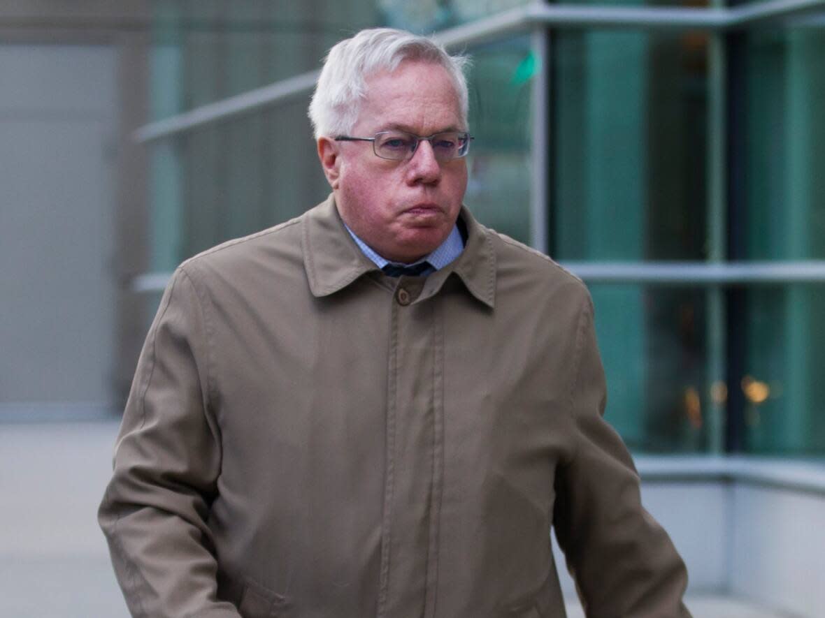 Retired neurologist Keith Hoyte leaves the courthouse in Calgary on Jan. 6, 2020. Hoyte has admitted in court to sexually assaulting dozens of female patients over three decades. (Todd Korol/The Canadian Press - image credit)