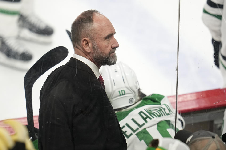 FILE - Dallas Stars head coach Pete DeBoer looks on during the third period of an NHL hockey game against the Minnesota Wild, Dec. 29, 2022, in St. Paul, Minn. The NHL coaching carousel last summer involved the Boston Bruins firing coach Bruce Cassidy and the Vegas Golden Knights doing the same to Peter DeBoer. Cassidy replaced DeBoer in Vegas and DeBoer went to the Dallas Stars. Jim Montgomery had been fired by the Stars three seasons ago for inappropriate conduct but had gotten back into the NHL as an assistant in St. Louis. Montgomery then replaced Cassidy in Boston. All three teams led their respective division at the All-Star break and are on track to make the playoffs. (AP Photo/Abbie Parr, file)