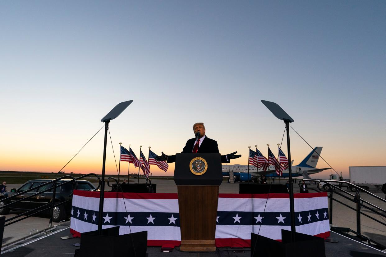 <p>Donald Trump speaks at a campaign rally at Rochester International Airport in Minnesota on 30 October.</p> (AP)