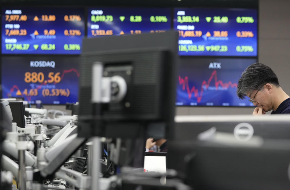 A currency trader works at the foreign exchange dealing room of the KEB Hana Bank headquarters in Seoul, South Korea, Tuesday, March 12, 2024. Shares were mostly higher in Asia on Tuesday ahead of a report on inflation in the U.S. that could sway the Federal Reserve’s timing on cutting interest rates. (AP Photo/Ahn Young-joon)