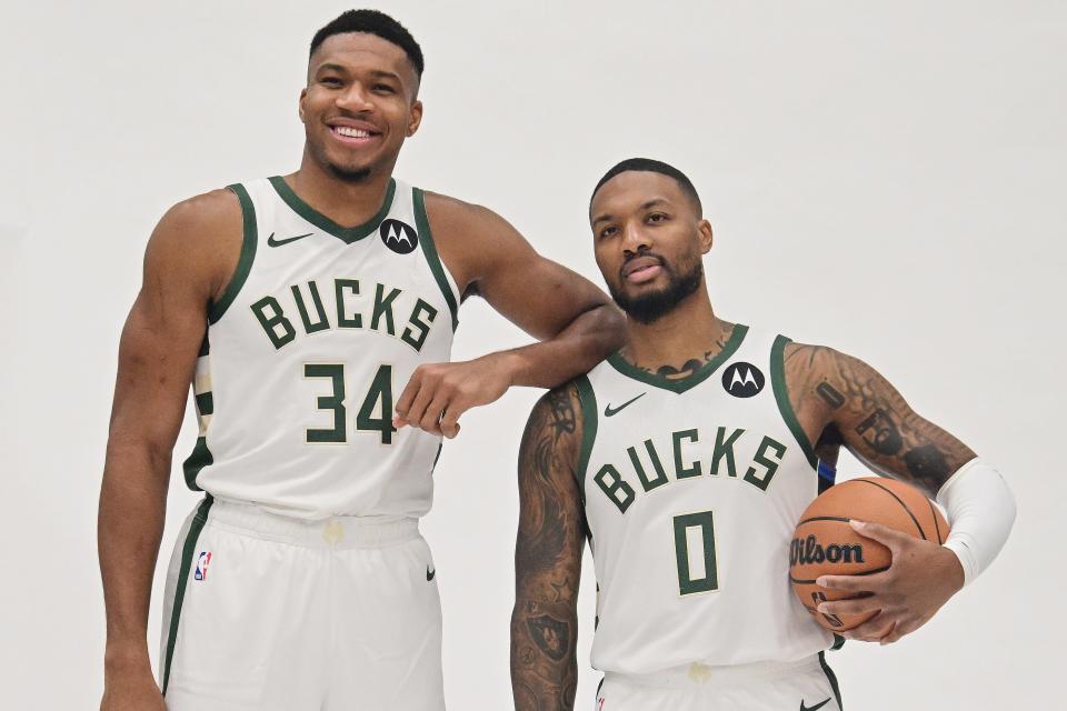 Giannis Antetokounmpo, the star forward for the Milwaukee Bucks stands next to point guard Damian Lillard during media day in Milwaukee. Lillard is divorcing his wife days after he was traded to the team from the Portland Trail Blazers.