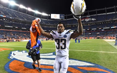 Los Angeles Chargers free safety Derwin James (33) celebrates the win over the Denver Broncos at Broncos Stadium at Mile High - Credit: USA TODAY