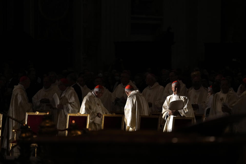 Cardinals arrive for a mass with Pope Francis in St. Peter's Basilica at the Vatican, Tuesday, Oct. 11, 2022. Pope Francis commemorates the 60th anniversary of the opening of the Second Vatican Council by celebrating a Mass in honor of St. John XXIII, the "good pope" who convened the landmark meetings that modernized the Catholic Church. (AP Photo/Alessandra Tarantino)