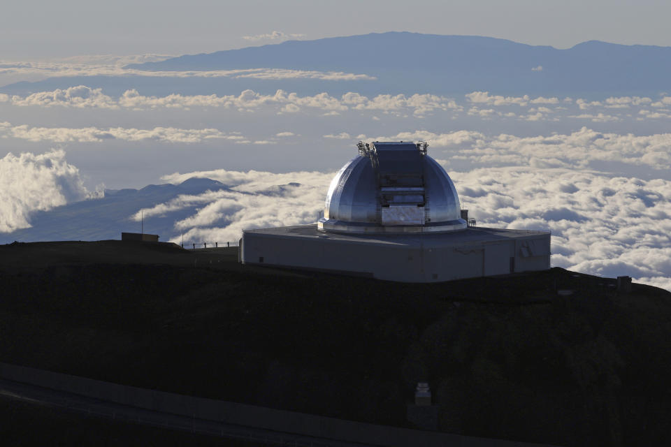 FILE - This July 14, 2019, file photo, shows a telescope at the summit of Mauna Kea, Hawaii's tallest mountain. The National Science Foundation has launched an informal outreach to Hawaii about possible funding efforts for the stalled Thirty Meter Telescope project. The Honolulu Star-Advertiser reported the effort by the nation's top funder of basic research could lead to a huge influx of cash for the astronomy project on Mauna Kea with an estimated cost of $2.4 billion. Funding efforts could also trigger a regulatory process adding two years or more to the construction timeline. Telescope opponents who demonstrated for months say the project on the state's tallest mountain would desecrate land considered sacred by some Native Hawaiians. (AP Photo/Caleb Jones, File)