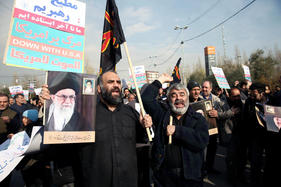 Demonstrators react during a protest against the assassination of the Iranian Major-General Qassem Soleimani, head of the elite Quds Force, and Iraqi militia commander Abu Mahdi al-Muhandis who were killed in an air strike in Baghdad airport, in Tehran, Iran January 3, 2020. WANA (West Asia News Agency)/Nazanin Tabatabaee via REUTERS ATTENTION EDITORS - THIS IMAGE HAS BEEN SUPPLIED BY A THIRD PARTY.