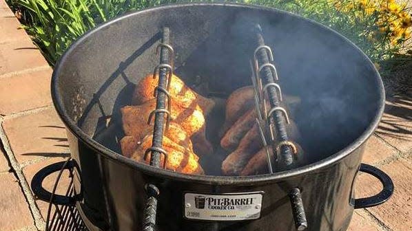 Smoke ribs, chickens, brisket and more in the Pit Barrel.