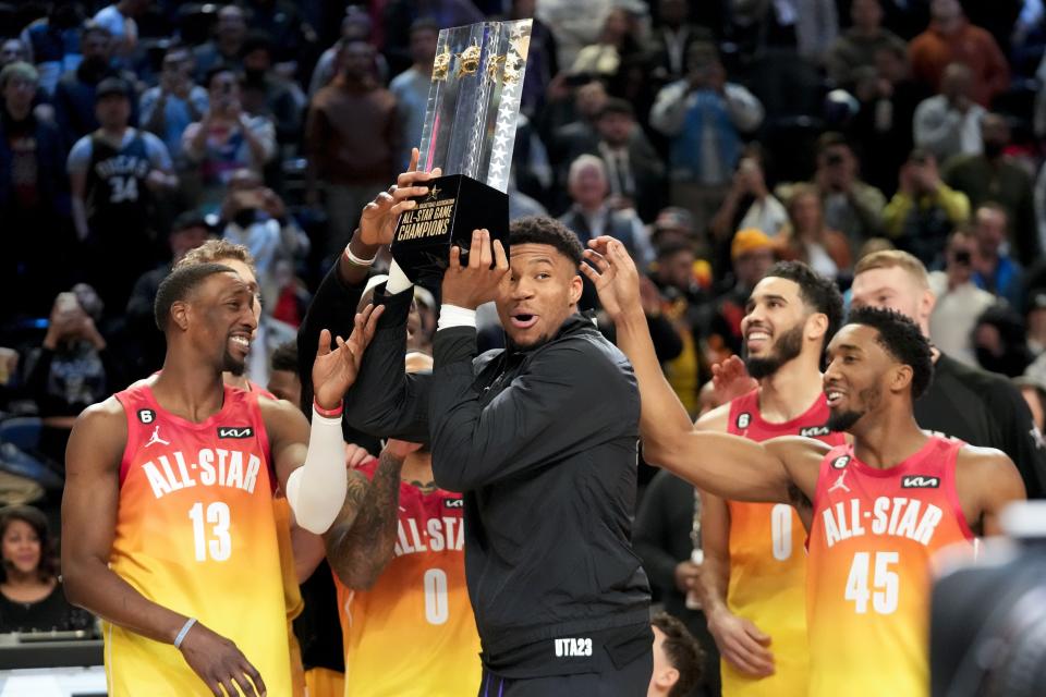 Giannis Antetokounmpo hold up the winning team trophy after the NBA basketball All-Star game Sunday, Feb. 19, 2023, in Salt Lake City. (AP Photo/Rick Bowmer)