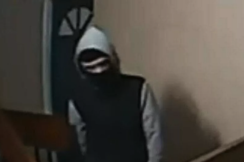 The creepy hooded figure was reportedly lurking outside the flat during the early hours