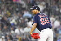 Boston Red Sox starting pitcher Brayan Bello (66) prepares to throw against a New York Yankees batter in the rain during the sixth inning of a baseball game Sunday, Sept. 25, 2022, in New York. (AP Photo/Jessie Alcheh)