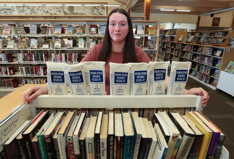 Librarian Margot O'Connell stood next to overdose rescue kits that are stored at the Sitka Public Library in Sitka, Alaska, on Aug. 26, 2023. The staff keeps the kits on hand in case they have to treat an overdose victim.