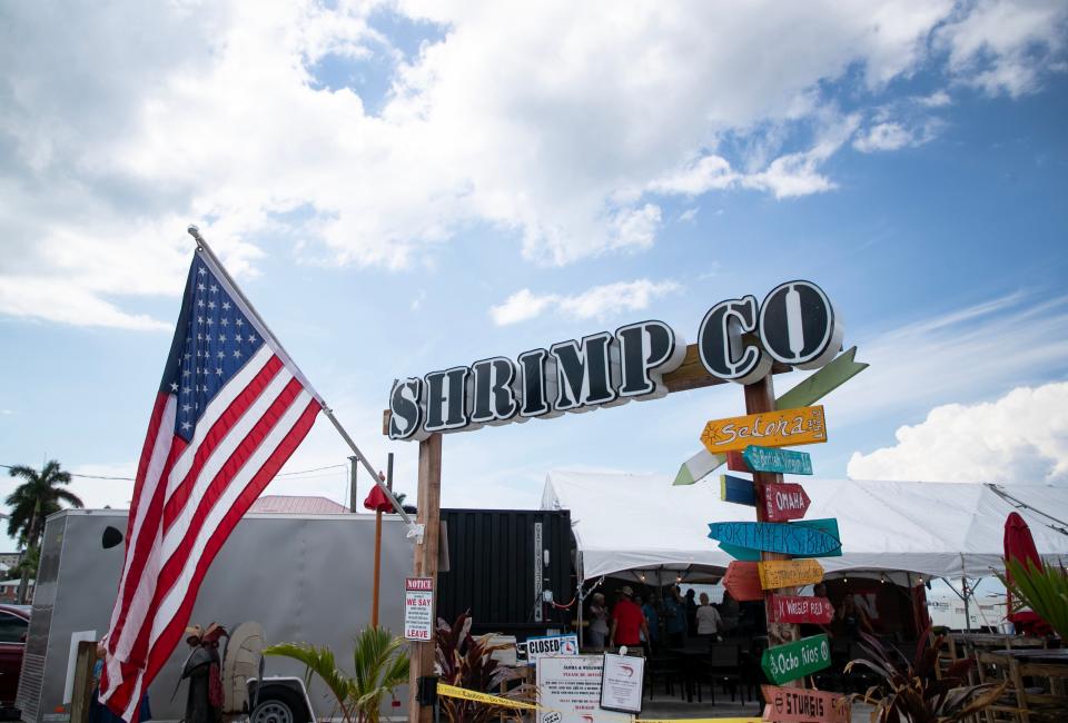 Lisa Lahners and TJ Holzapfel, the owners of The RUDE Shrimp Company, salvaged part of the original sign after Hurricane Ian destroyed their restaurant on Fort Myers Beach. They reopened in a new location at Moss Marina in June 2023.